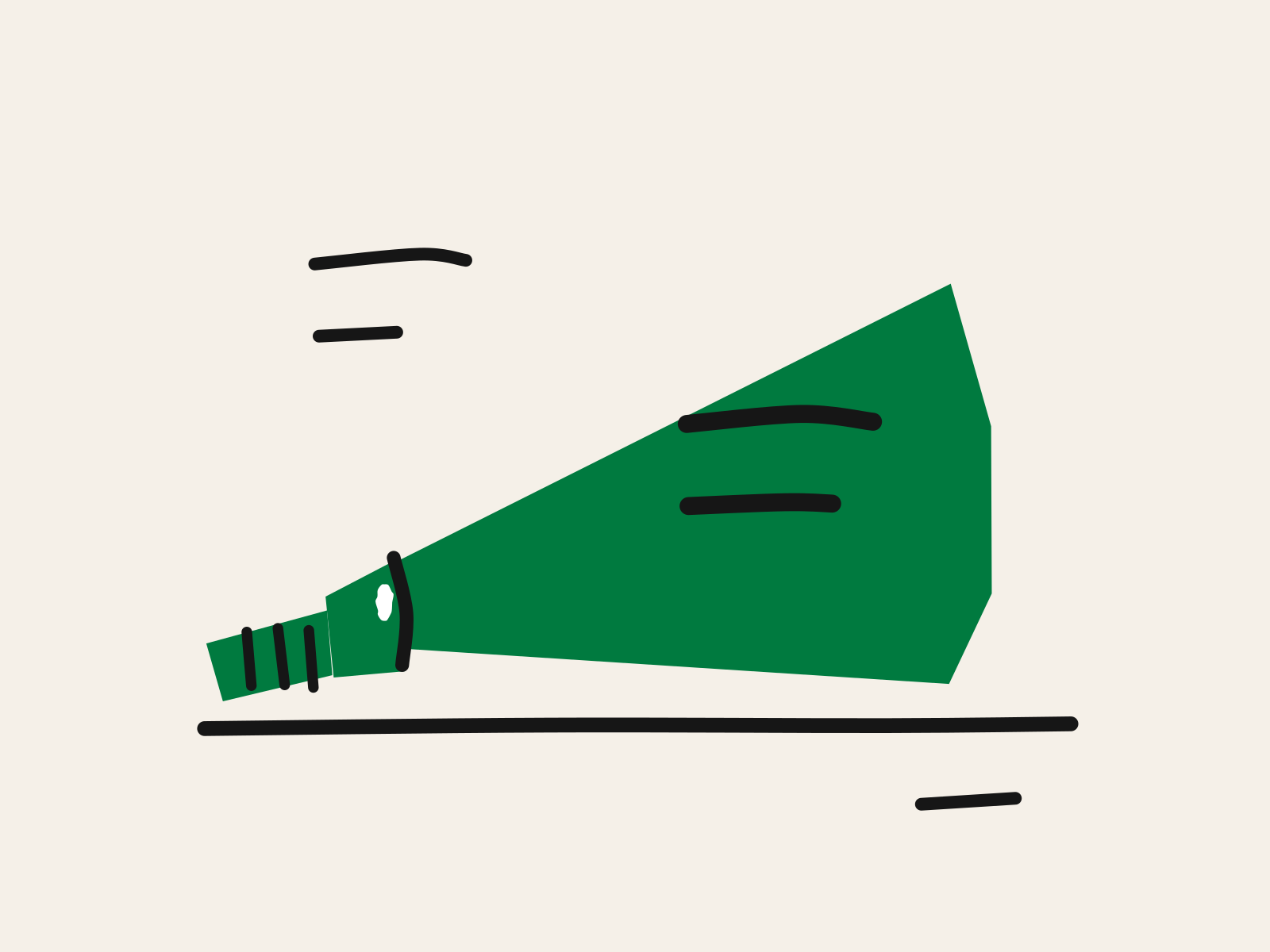 A cut-paper green flashlight lying on a floor and throwing one bright beam up a wall, with two marks clearly lit inside the beam and three more still in the dark outside it.