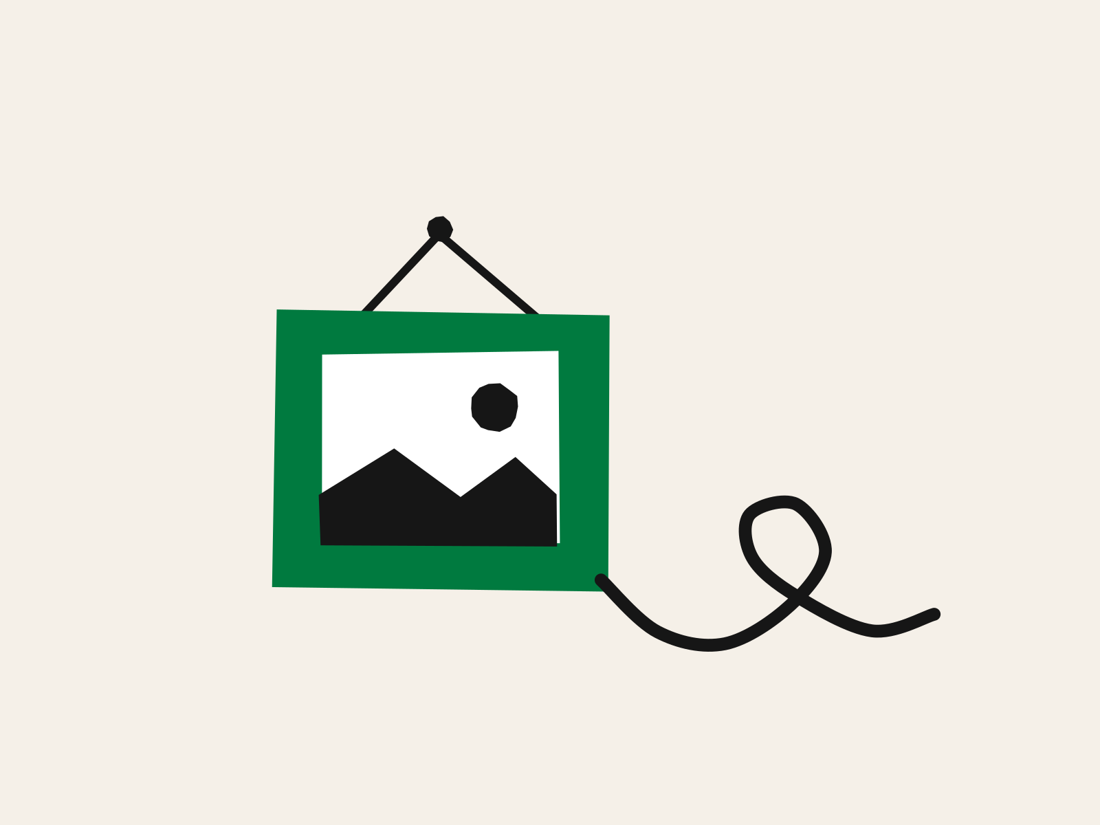 A green cut-paper picture frame hanging from a black nail, holding a white panel with a small black hill and sun, and a long black string trailing from its lower corner and curling away, standing for a family keepsake and the unseen path a photo can take once uploaded.